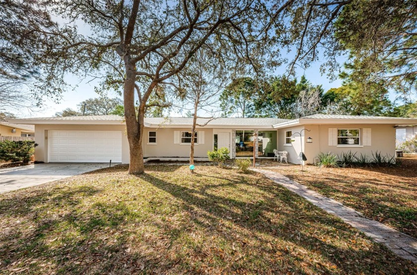 This Mid-Century Modern ranch home is centrally located just - Beach Home for sale in Dunedin, Florida on Beachhouse.com