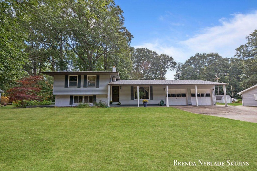 Welcome to this spacious quad-level home just 1/2 mile from - Beach Home for sale in Grand Haven, Michigan on Beachhouse.com