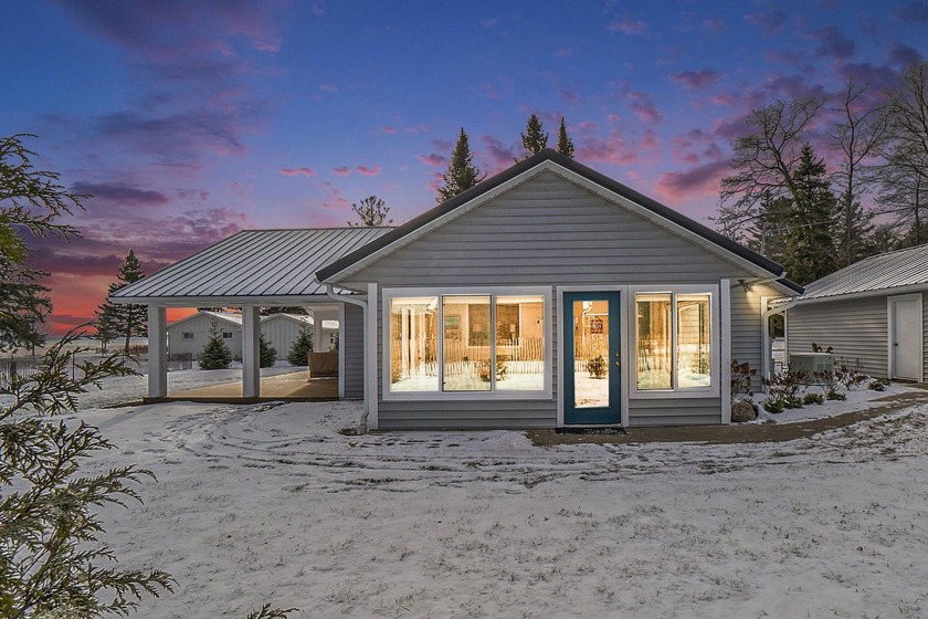 Step into this timeless waterfront cottage on the beautiful - Beach Home for sale in Ocqueoc, Michigan on Beachhouse.com