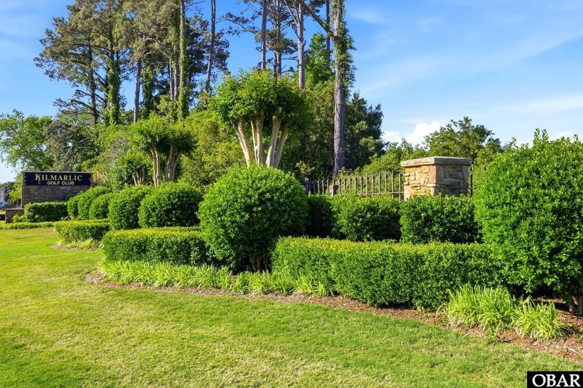 Nestled along the pristine Kilmarlic Club Golf Course, this - Beach Lot for sale in Powells Point, North Carolina on Beachhouse.com