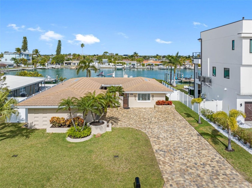 Step into a world of waterfront living with this beautifully - Beach Home for sale in Treasure Island, Florida on Beachhouse.com
