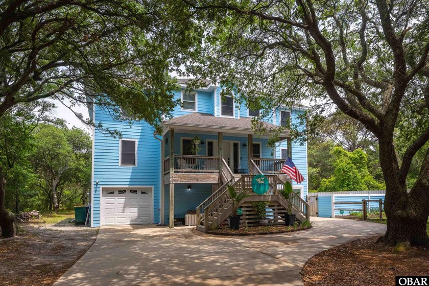 Tucked away beneath a canopy of majestic live oaks in the - Beach Home for sale in Southern Shores, North Carolina on Beachhouse.com