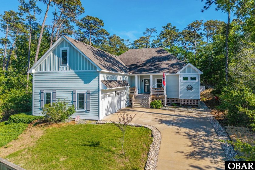 Nestled in the serene Carlyle on the Sound community of Kill - Beach Home for sale in Kill Devil Hills, North Carolina on Beachhouse.com