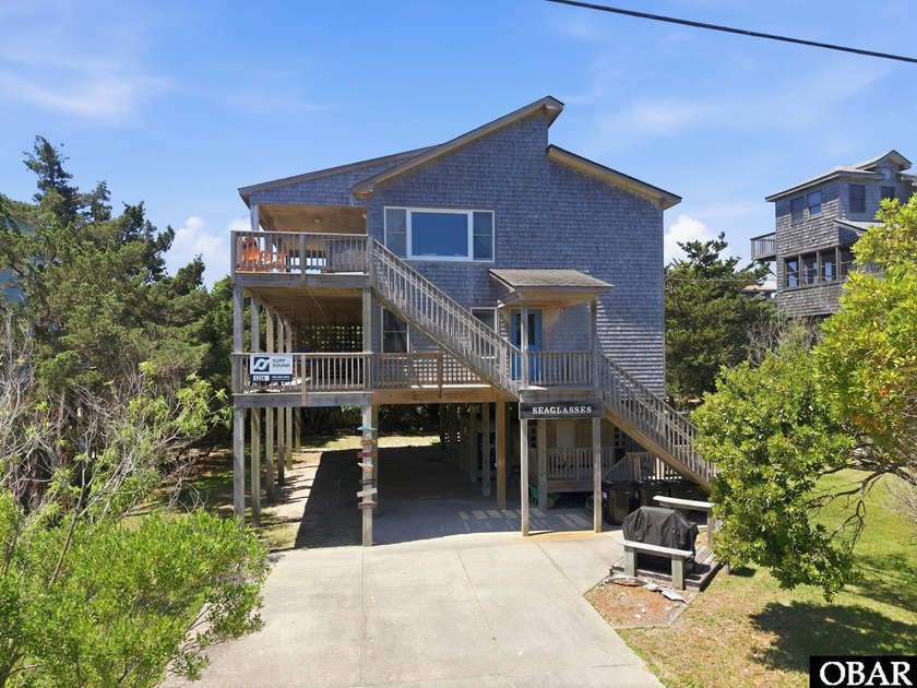 Nestled among the live oaks in the heart of Frisco, *Seaglasses* - Beach Home for sale in Frisco, North Carolina on Beachhouse.com