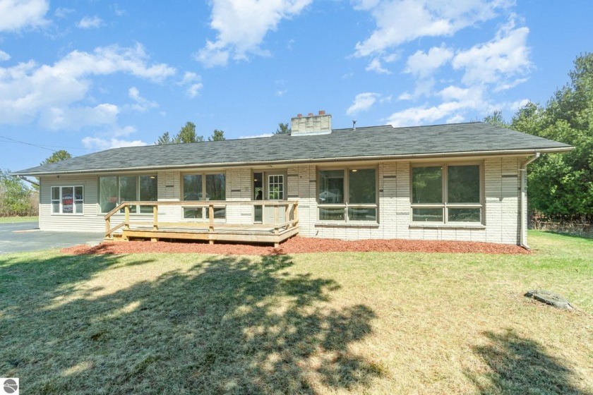 Nestled just a mile from Lake Huron along M-55 and conveniently - Beach Home for sale in Tawas City, Michigan on Beachhouse.com