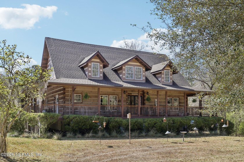 Welcome home to this charming 3 bedroom, 2 1/2 bath log cabin - Beach Home for sale in Green Cove Springs, Florida on Beachhouse.com