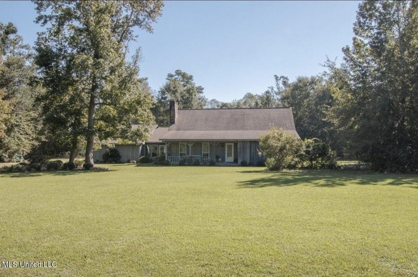 This spacious home offers exceptional privacy with mature trees - Beach Home for sale in Long Beach, Mississippi on Beachhouse.com