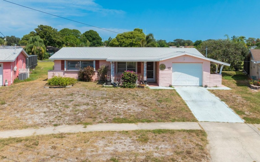 Situated in the serene Forest Hills neighborhood, this - Beach Home for sale in Holiday, Florida on Beachhouse.com