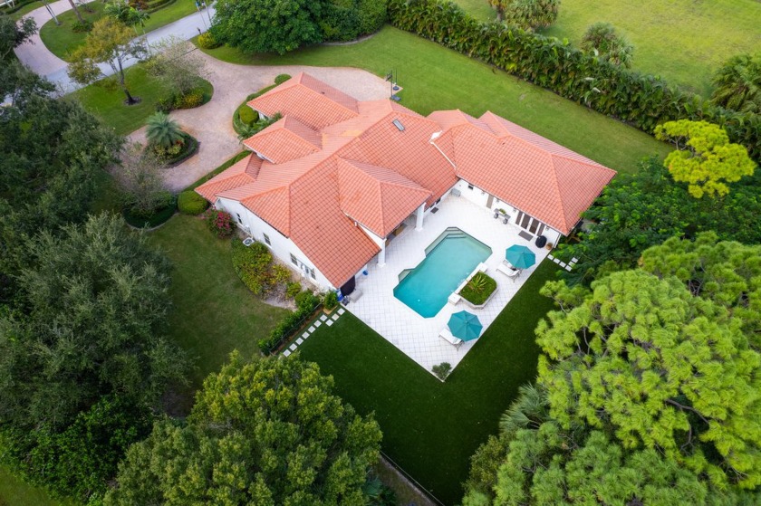 Welcome to  this private oasis at 5801 Whirlaway Rd. Nestled - Beach Home for sale in Palm Beach Gardens, Florida on Beachhouse.com