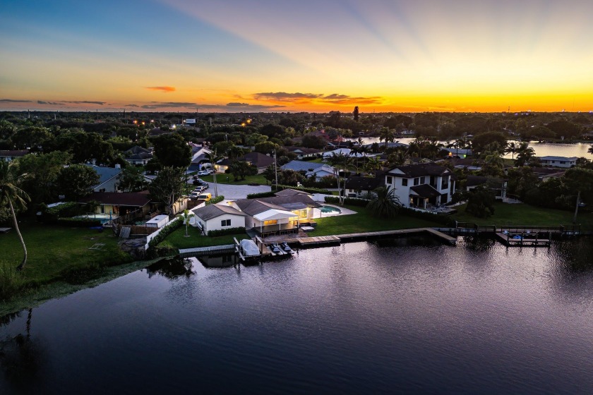 Discover a rare gem on the shores of Lake Osborne.  This 3 bdrm - Beach Home for sale in Lake Worth, Florida on Beachhouse.com