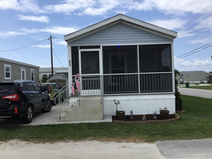 This two bedroom, two bath home is in a 55+ community that sits - Beach Home for sale in Merritt Island, Florida on Beachhouse.com