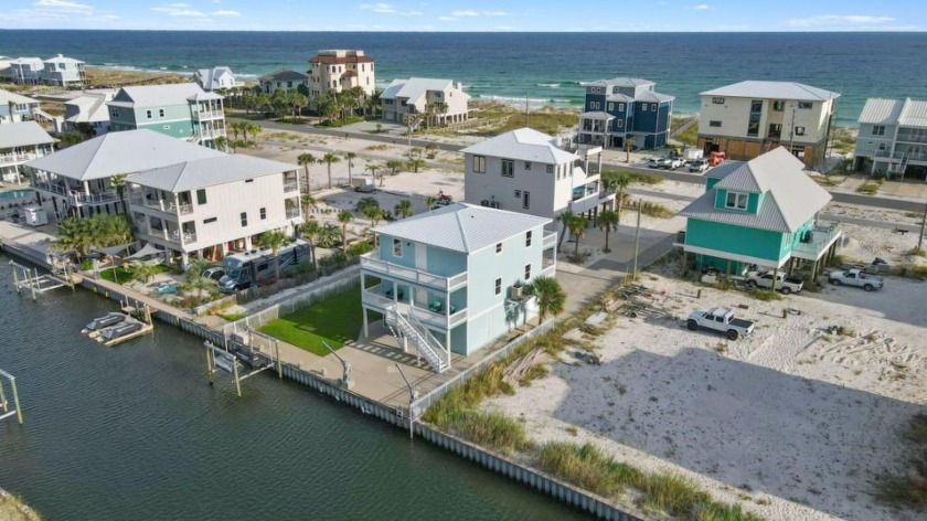 Own and experience unparalleled COASTAL CANAL WATERFRONT LIVING! - Beach Home for sale in Navarre, Florida on Beachhouse.com