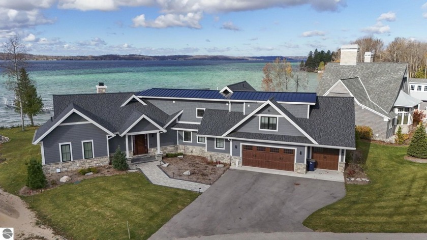 TORCH LAKE - 131' OF SANDY FRONTAGE - Don't miss out on the - Beach Home for sale in Alden, Michigan on Beachhouse.com
