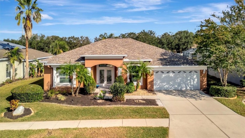 Discover this spacious lakefront pool home featuring 4 bedrooms - Beach Home for sale in Bradenton, Florida on Beachhouse.com