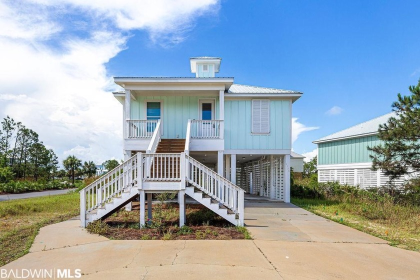 Enjoy SUMMER ALL YEAR LONG in this CHEERFUL and IMMACULATE four - Beach Home for sale in Gulf Shores, Alabama on Beachhouse.com