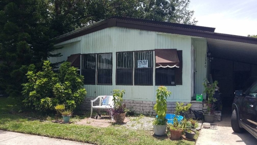 This Double-wide 2BR/2BA awaits its new owner who can offer a - Beach Home for sale in New Port Richey, Florida on Beachhouse.com