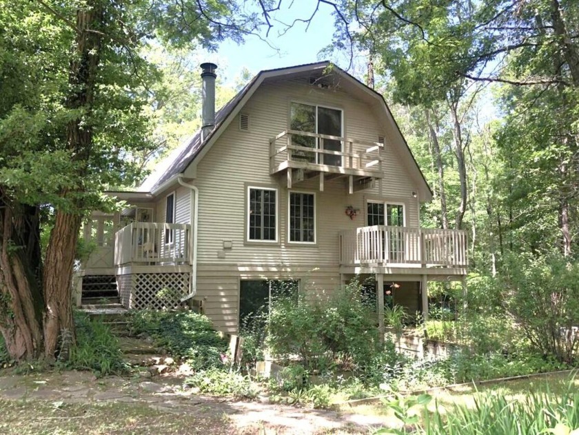 Nestled amidst 29 acres of serene woodland, this barn-style - Beach Home for sale in Muskegon, Michigan on Beachhouse.com