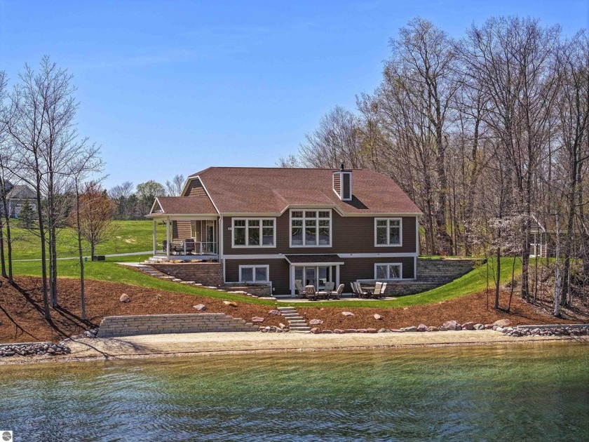 Discover a beautiful secluded waterfront retreat nestled on 2.07 - Beach Home for sale in Traverse City, Michigan on Beachhouse.com