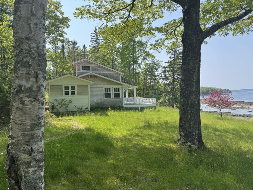 This lovely cottage sits on waters edge, the style is open with - Beach Home for sale in Deer Isle, Maine on Beachhouse.com