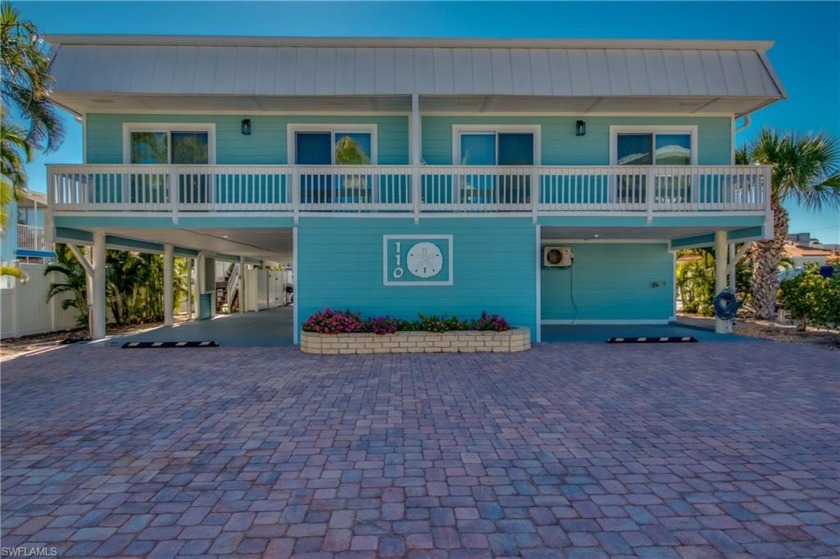 This rare quadplex with 6BD/6BA sits on a wide canal in a weekly - Beach Home for sale in Fort Myers Beach, Florida on Beachhouse.com