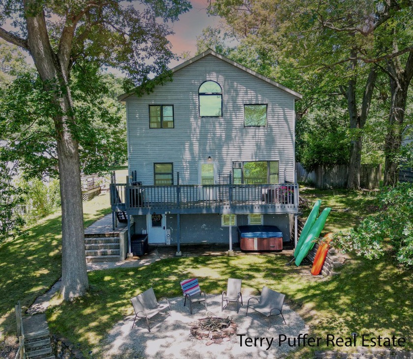 This freshly updated contemporary-style home offers a serene - Beach Home for sale in Muskegon, Michigan on Beachhouse.com