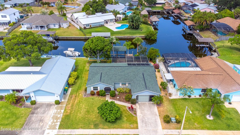 Fantastic canal front home with a solar pool, boat lift - Beach Home for sale in Merritt Island, Florida on Beachhouse.com