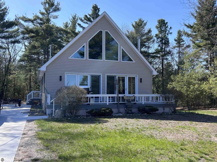 Two bedrooms and 2 1/2 bathrooms, this cozy chalet has Lake - Beach Home for sale in Oscoda, Michigan on Beachhouse.com