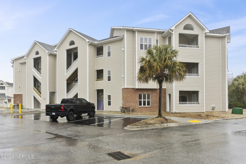 Discover elevated coastal living in this newly constructed - Beach Condo for sale in Carolina Beach, North Carolina on Beachhouse.com