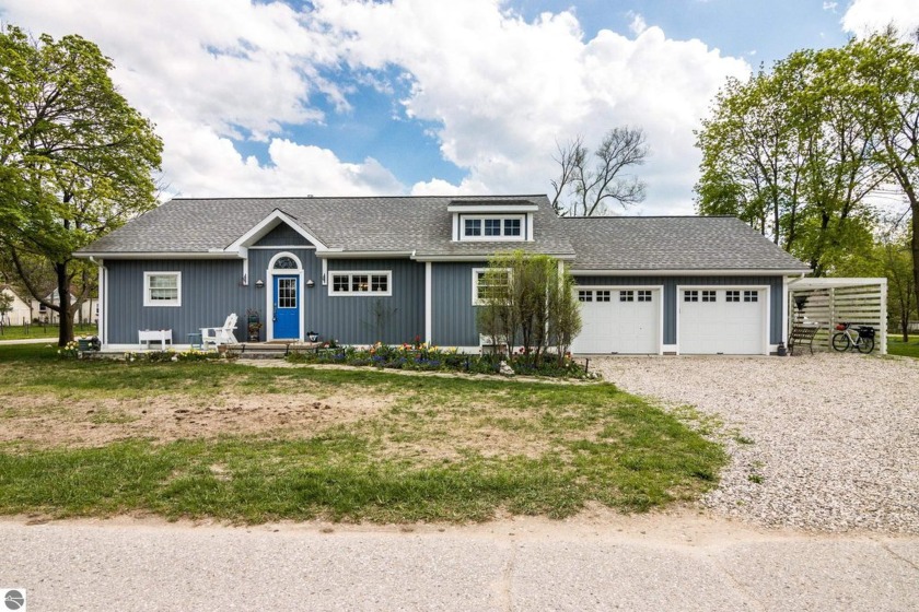 Welcome to this beautifully crafted 3-bedroom, 2-bathroom custom - Beach Home for sale in Elk Rapids, Michigan on Beachhouse.com