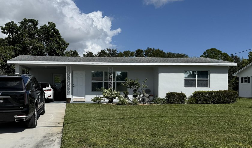 No HOA! Enjoy true Florida living on a navigable canal with - Beach Home for sale in Lake Worth, Florida on Beachhouse.com