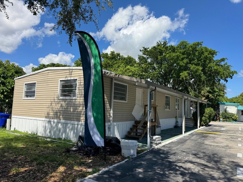 Fully Remodeled 4-Bedroom, 2-Bath Mobile Home in Blue Grass - - Beach Home for sale in West Palm Beach, Florida on Beachhouse.com