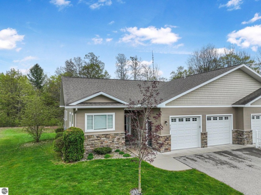 Enjoy peaceful living in this beautifully maintained 4-bedroom - Beach Condo for sale in Traverse City, Michigan on Beachhouse.com