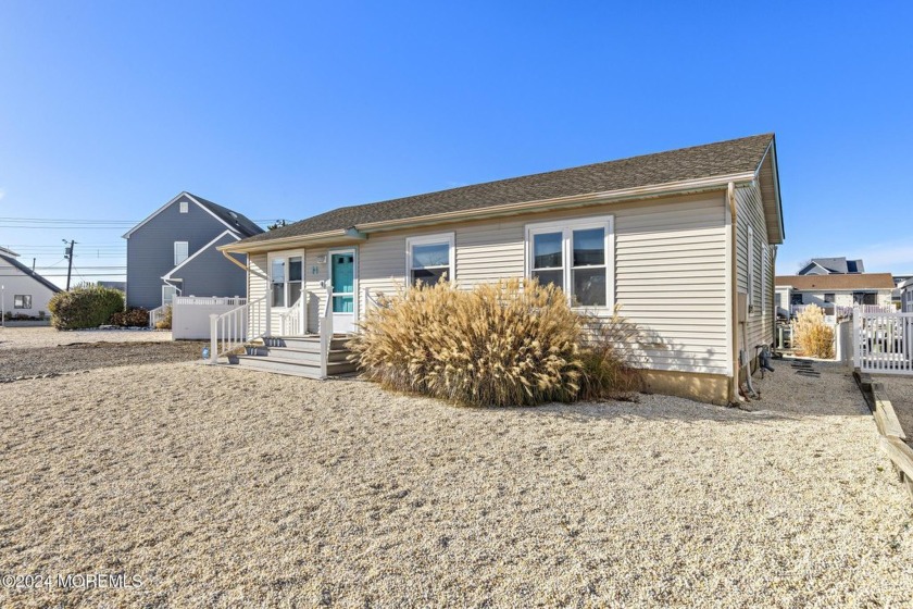 This waterfront home in the desirable East Point section of - Beach Home for sale in Manahawkin, New Jersey on Beachhouse.com