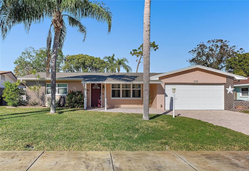 STUNNING LAKEFRONT HOME WITH AN INCREDIBLE BACKYARD BUILT FOR - Beach Home for sale in Seminole, Florida on Beachhouse.com