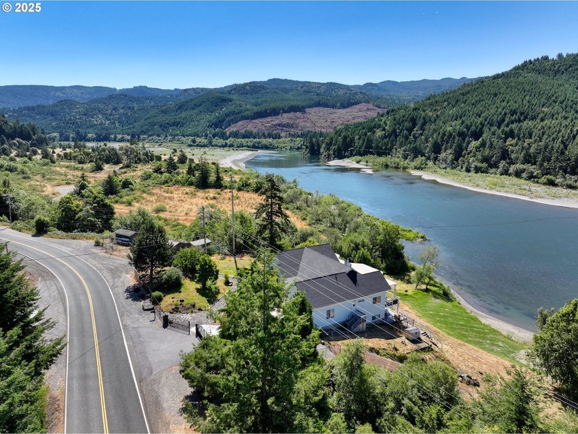 This beautifully remodeled 4 bedroom, 3 bath home sits on 7.5 - Beach Home for sale in Gold Beach, Oregon on Beachhouse.com