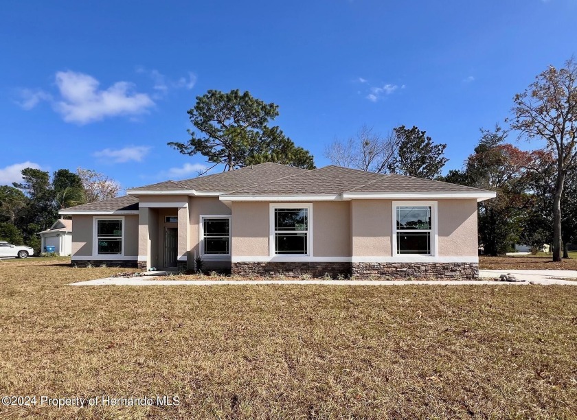 This Brand- New Construction (Includes the land!)4/2.5/2 home is - Beach Home for sale in Spring Hill, Florida on Beachhouse.com