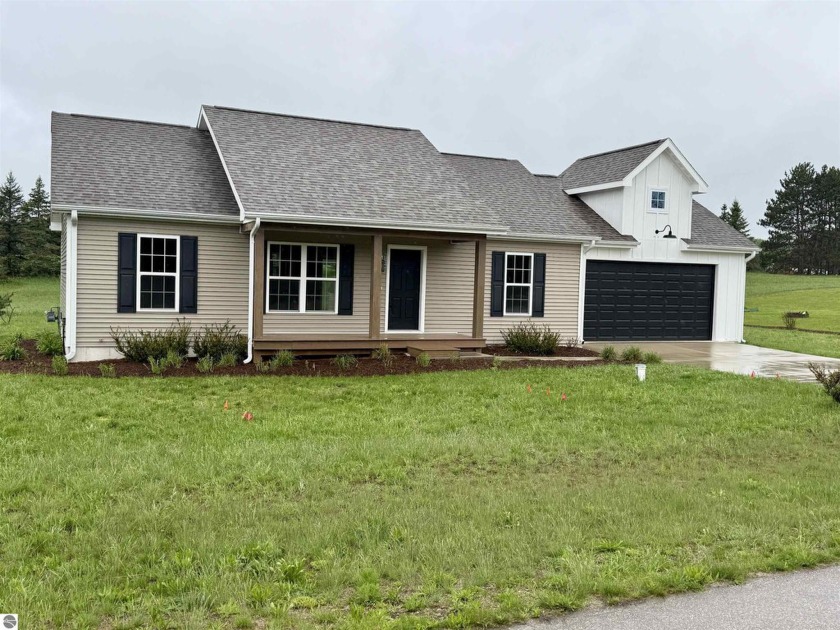 Modern updates, thoughtful design, and a peaceful setting come - Beach Home for sale in Maple City, Michigan on Beachhouse.com