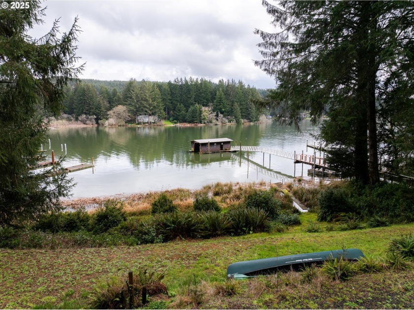 Rare Siltcoos Lakefront Opportunity - 4.65 Acres with Cabins - Beach Home for sale in Florence, Oregon on Beachhouse.com