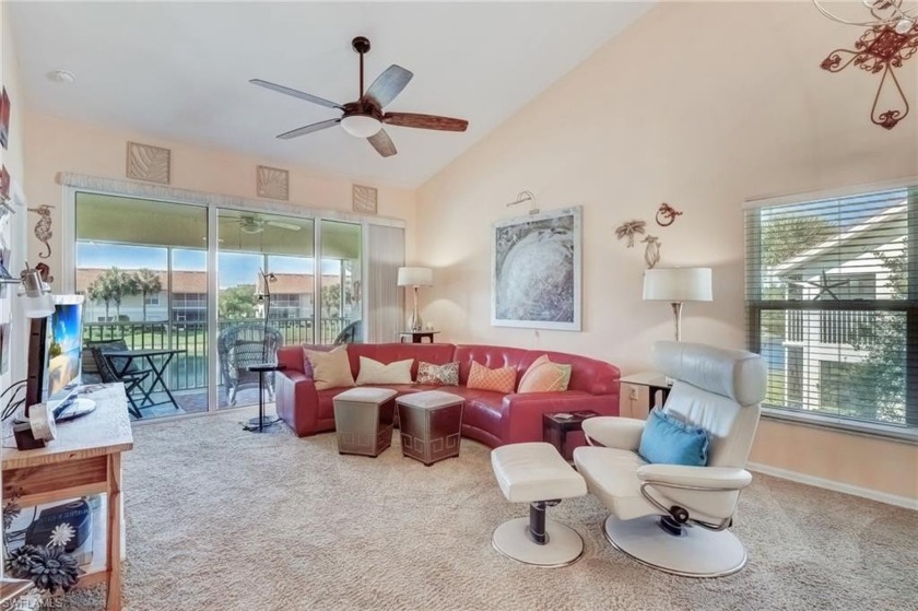 Lake and fountain views await you from this 2nd floor, end-unit - Beach Home for sale in Naples, Florida on Beachhouse.com