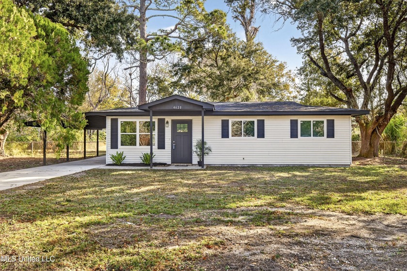 Coastal comfort meets classic cottage charm! Step into this - Beach Home for sale in Ocean Springs, Mississippi on Beachhouse.com