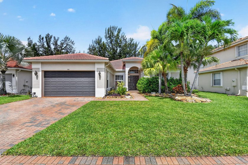 This beautiful one story 5/3 home has a large open floor plan - Beach Home for sale in Royal Palm Beach, Florida on Beachhouse.com