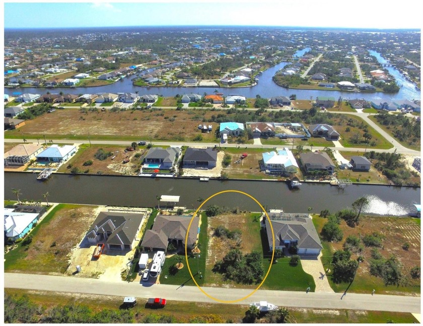 Waterfront Lot For Sale with 80 feet of concrete seawall with a - Beach Lot for sale in Port Charlotte, Florida on Beachhouse.com