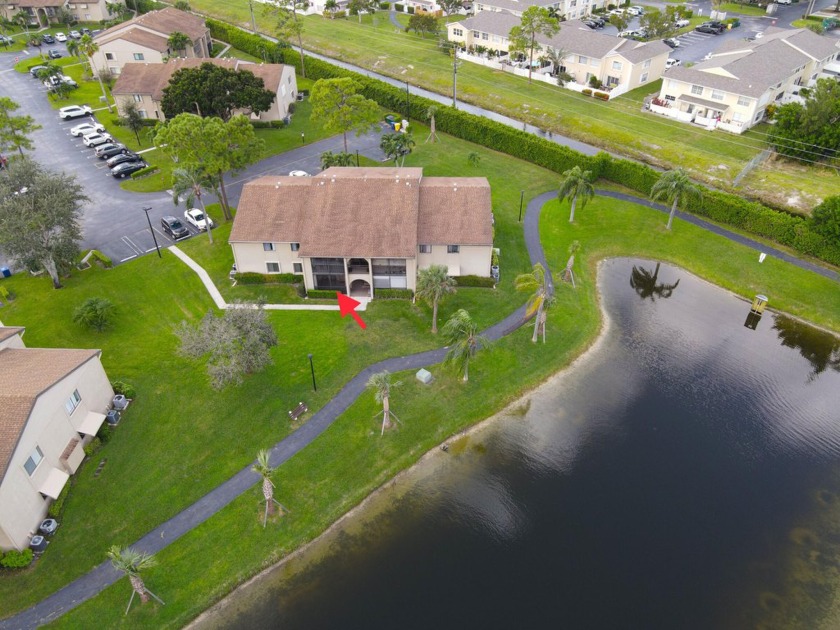 ENJOY RELAXING WATER VIEWS FROM YOUR SCREENED PATIO IN THIS - Beach Condo for sale in Greenacres, Florida on Beachhouse.com