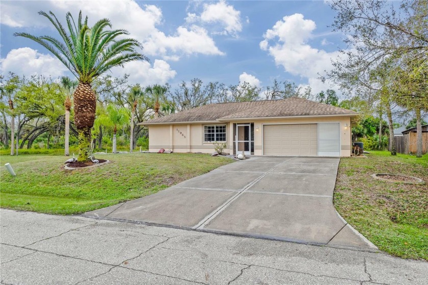 This charming 3-bedroom, 2-bathroom home is situated on a double - Beach Home for sale in Port Charlotte, Florida on Beachhouse.com