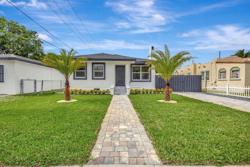 Experience modern living in this fully remodeled 3-bedroom - Beach Home for sale in West Palm Beach, Florida on Beachhouse.com