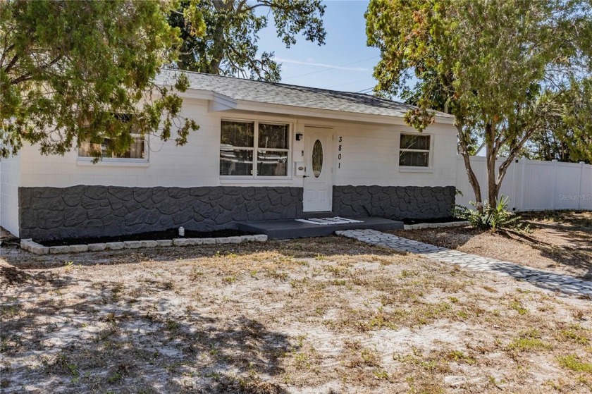 Welcome to this inviting 3 bed, 1.5 bath home situated on a - Beach Home for sale in St. Petersburg, Florida on Beachhouse.com