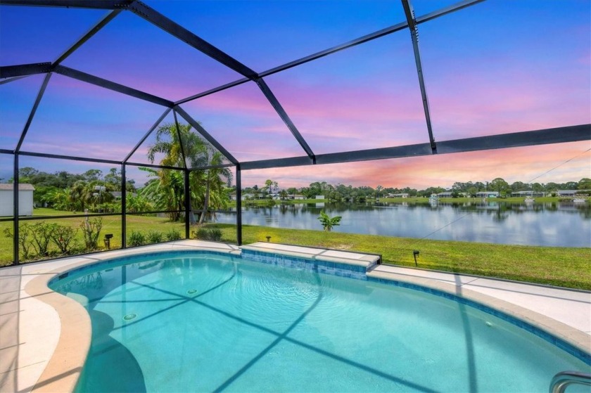 MOTIVATED SELLER!POOL! WATERFRONT! PUBLIC WATER AND PUBLIC - Beach Home for sale in North Port, Florida on Beachhouse.com