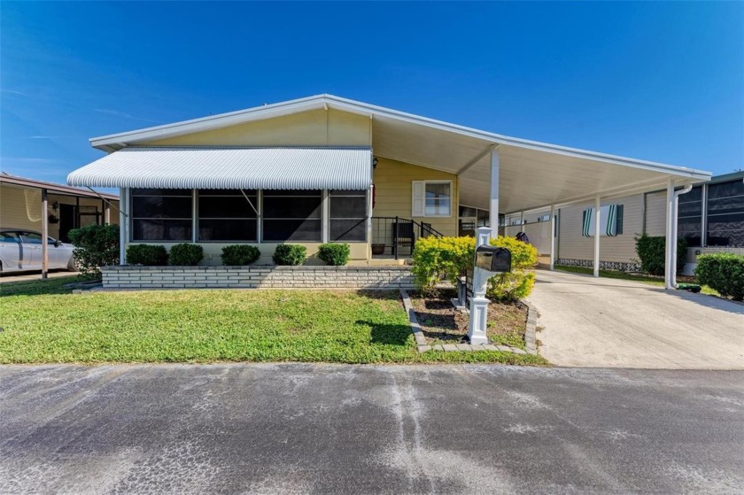 Nestled within the serene and sought-after Arbors Mobile Home - Beach Home for sale in Osprey, Florida on Beachhouse.com