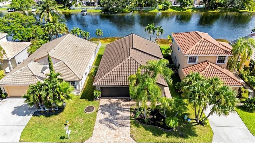 RARE LAKEFRONT FIND! Enjoy serene waterfront living in this - Beach Home for sale in Pembroke Pines, Florida on Beachhouse.com