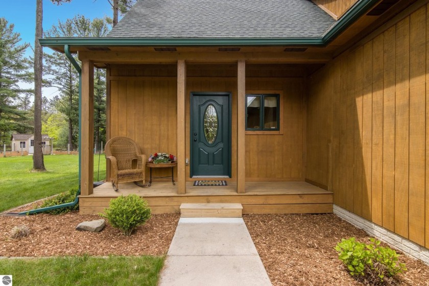 Private Up-North lodge retreat nestled on 2.26 acres and backing - Beach Home for sale in Traverse City, Michigan on Beachhouse.com